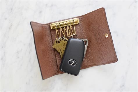 louis vuitton key holder vs key pouch|louis vuitton keychain card holder.